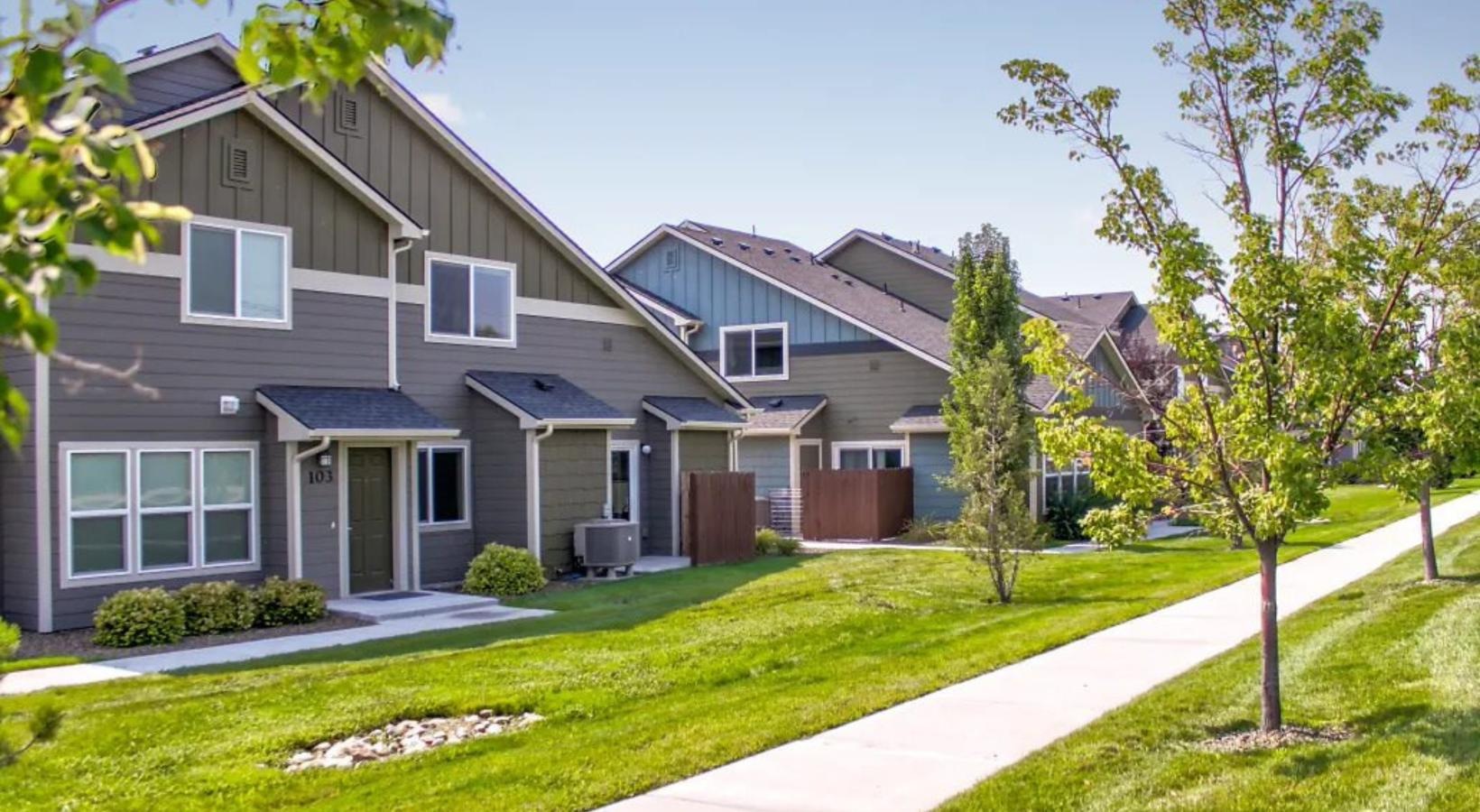 a building with a long sidewalk